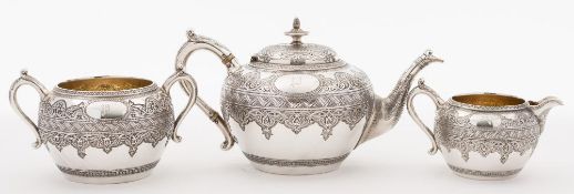 A Victorian Scottish silver three-piece tea service, maker JR, Glasgow, 1876: initialled,