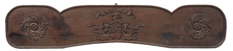 A mid 18th century carved oak cart tail board: of shaped rectangular outline,