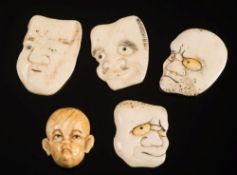 A group of Japanese ivory discs carved with humorous faces: all unsigned, each approx 3.5cm.