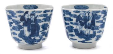 A pair of Chinese porcelain cups: of canted square form decorated in blue with the eight Buddhist