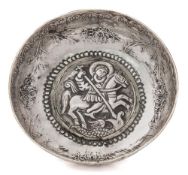 A Greek/Ottoman silver dish: of shallow circular form with central raised boss repousse decorated