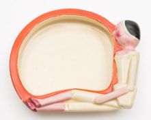 A Clarice Cliff Joan Shorter Kiddies Ware 'Peg Doll' cereal bowl: of heavily potted shallow form,