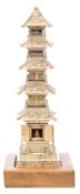 A Japanese carved ivory model of a shrine: of pagoda style,