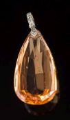 A teardrop topaz single-stone pendant: the teardrop topaz 30mm long x 14.