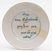 A rare late 17th century Dutch blue and white delft 'Earthquake' plate: inscribed '1692 Den 18