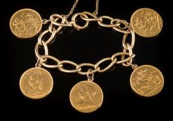 A curb-link bracelet with five various attached sovereigns: and attached safety chain,