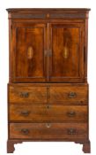 A Georgian mahogany and inlaid gentleman's wardrobe:, bordered with boxwood lines,
