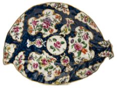 A First Period Worcester porcelain leaf shaped dish: decorated in coloured enamels with garden