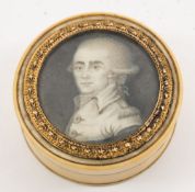 A 19th century ivory and tortoiseshell circular box: the lift-off lid inset with a minature of a