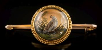 A late 19th century reverse painted crystal intaglio bar brooch: the circular crystal 19mm diameter