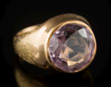 An 18ct gold and circular amethyst single-stone ring: the shank engraved 'PAX' one each side,