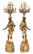 A pair of contemporary Blackamoor candelabra figures:, decorated in colours of green,