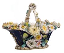 A Coalbrookdale porcelain basket: of oval form, the handle rim and sides with floral encrustation,