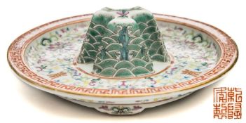 A Doucai porcelain Jue stand: of shallow circular form on four short feet with central