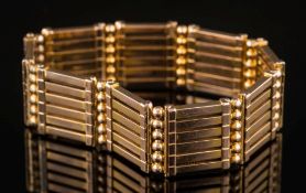 A late 19th / early 20th century gold gate-link bracelet of expanding flexible linking:.