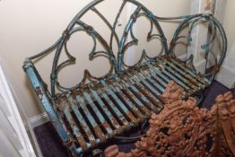 A wrought iron garden seat:,