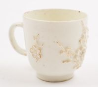 A Bow porcelain cup: the exterior sprigged with prunus branches, in the white,