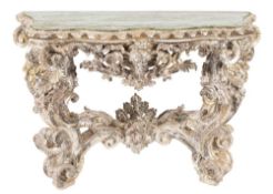 A 19th Century Italian carved wood and silvered side table:,