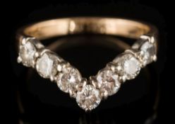 A diamond mounted seven-stone ring: with circular,