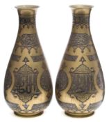 A pair of Middle Eastern brass and silver inlaid vases: of ovoid form with flared rim,