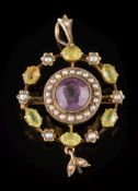 An early 20th century gold, amethyst, peridot and seed pearl circular pendant brooch: ,