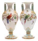 A pair of mid 19th century English porcelain vases: of two-handled baluster form,