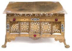 A late 19th century square brass and gilt metal stand: with pierced trellis decoration to the