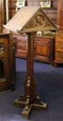 A late Victorian oak double sided lectern:, each with a ledge,