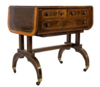 An early 19th Century rosewood and inlaid sofa table:, bordered with sycamore,