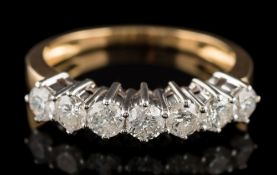 A diamond seven-stone half hoop ring: with circular,