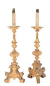 A pair of Italian gilt and silvered metal pricket candlesticks in the Rennaisance taste:,