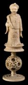 A mixed lot of Canton carved ivory: comprising a 'mandarin pattern' chess piece on puzzle ball