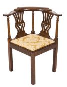 A Georgian mahogany corner elbow chair:, the back with shaped top rail and pierced vase splats,