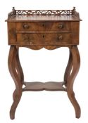 A 19th Century French mahogany work table:, with a pierced fret three quarter gallery,
