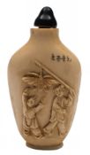 A carved ivory scent bottle: of ovoid form with figures carved in low relief to one side and