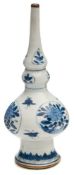 A Chinese porcelain water dropper: with gourd shaped neck, globular body and flaring foot,