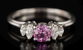 A pink sapphire and diamond five-stone ring: the circular pink sapphire 5.