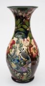 A large Moorcroft pottery vase: of baluster form tubelined in the Hidden Dreams pattern after an