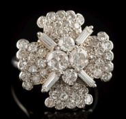 A diamond mounted quatrefoil cocktail cluster ring: pave-set with single-cut diamonds,