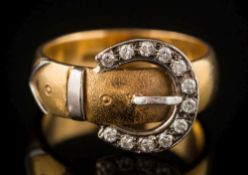 A 22ct gold and diamond-set 'buckle' ring: set with circular, brilliant-cut diamonds, 8.
