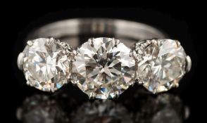 A graduated diamond three-stone ring: with circular, brilliant-cut diamonds 1.30cts,1.80cts and 1.
