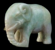 A Chinese carved jadeite figure of an elephant: 5 x 6 cm.