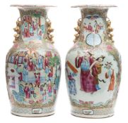 A pair of unusual Canton famille rose vases: with gilt lion dog and puppy handles,