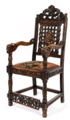 A Chinese carved wood open armchair:,