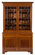 An Edwardian mahogany, satinwood crossbanded and inlaid bookcase:,