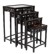 A set of Chinese carved and ebonised quartetto tables:,