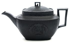 An Elijah Mayer black basalt Nelson commemorative teapot and cover: of rounded rectangular form