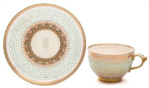 A Royal Worcester porcelain cup and saucer attributed to George Owen: of finely reticulated form