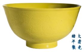 A Chinese yellow ground scraffito dragon bowl: with mildly everted rim and short cylindrical foot