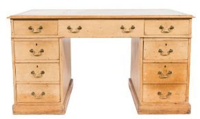 A 19th Century pine pedestal desk:, the rectangular top with a moulded edge,